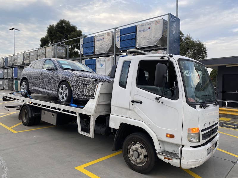 A new wrapped car is being towed from a Melbourne suburb to near Lalor.